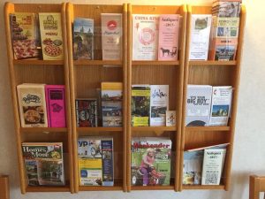 The Gathering Place hotel brochure rack in Michigan.