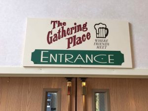 The Gathering Place hotel entrance sign in Michigan.