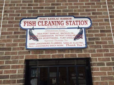 Port Sanilac Harbor Fish Cleaning Station sign.