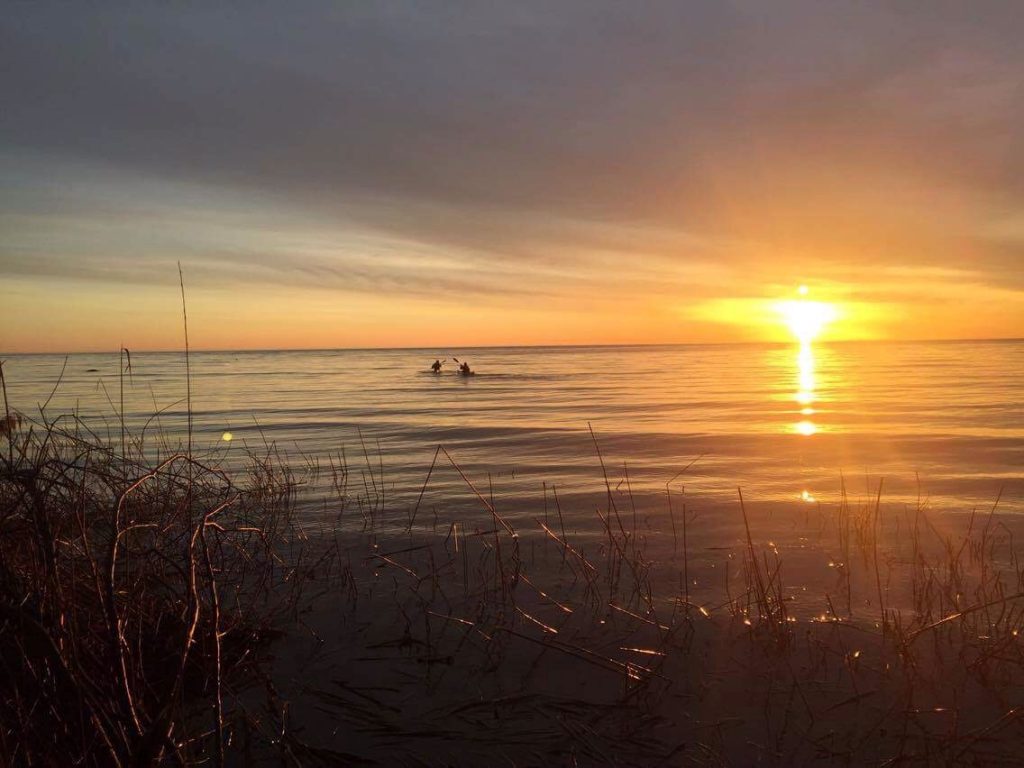 2 Paddling 5 in Michigan on a morning sunrise.