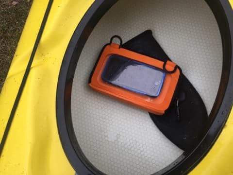 Ugo bag in kayak protects cell phone from water damage.