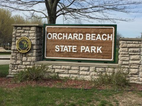 Orchard Beach State Park Michigan sign.