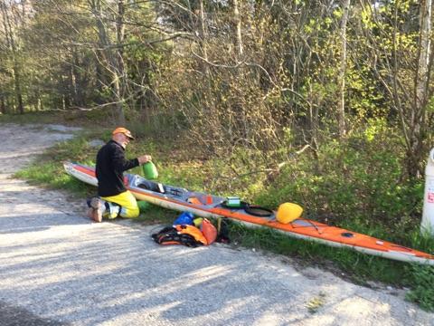 Joe Zellner preparing his orange Stellar Kayak in Duck Lake State Park Michigan. 