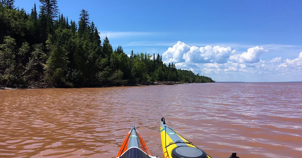 Churned up brown water near Amicon River on Lake Superior.