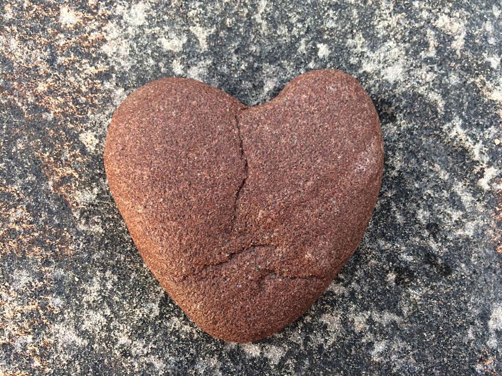 A reddish heart shaped rock.