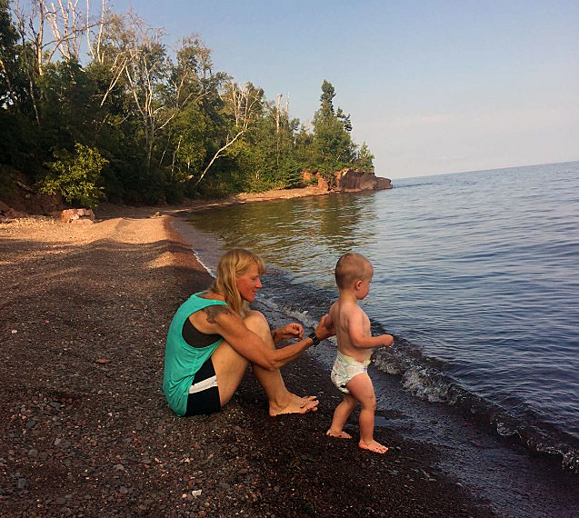 Peggy Gabrielson with her Grandson Brock on a Lake Superior beach.