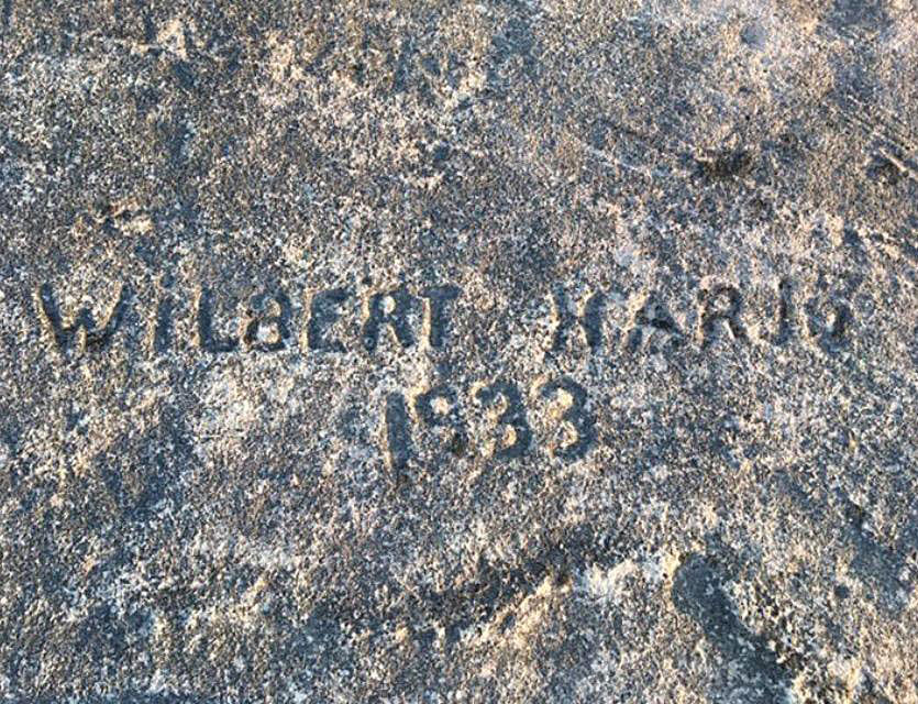 Wilbert Haris 1933 carved into stone on Lake Superior.